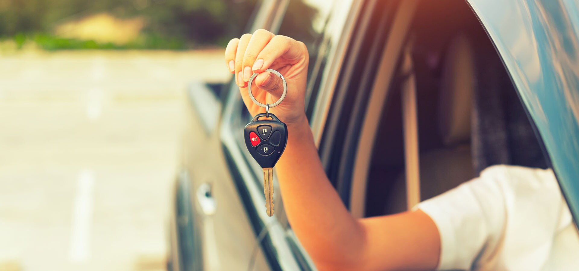 Why Finance From Cartopia 46? Customer showing off the keys to their pre-owned vehicle